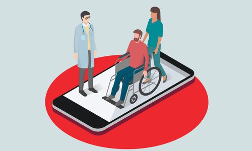 man in wheelchair at hospital on a phone