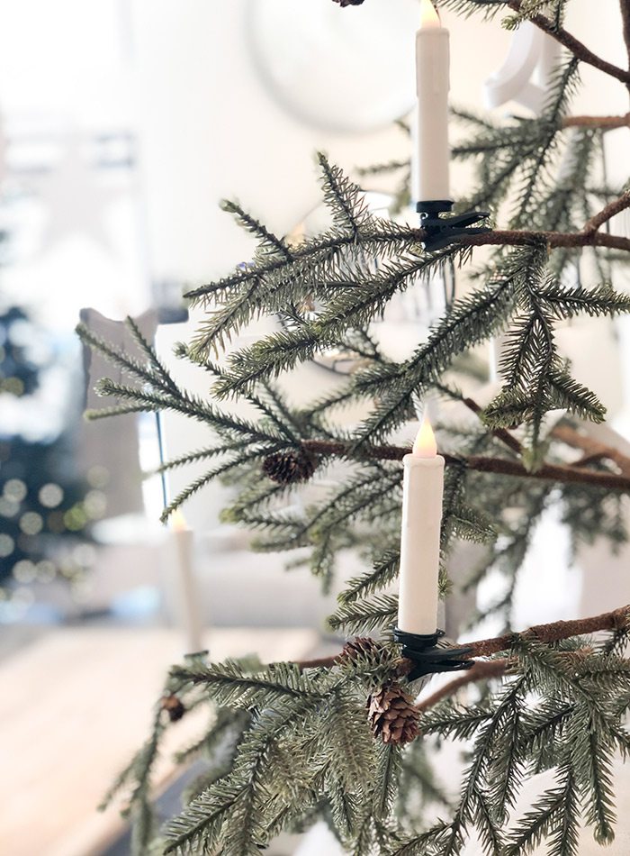 LED candle on a Christmas tree at House Counsel