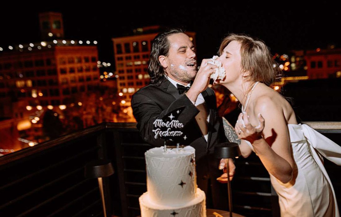 Bride and groom cutting their cake at Hotel Vandivort.