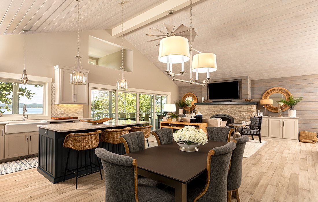 Cape Cod style lake house dining room, kitchen and living area in grays and whites