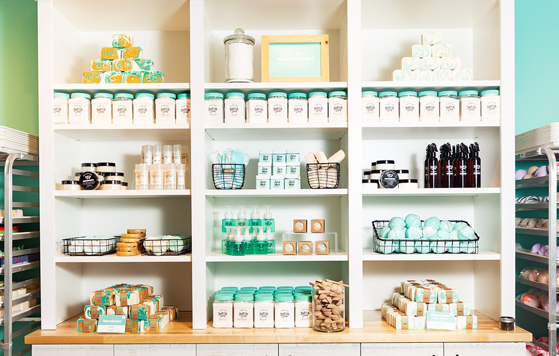 White shelves with Buff City Soaps products