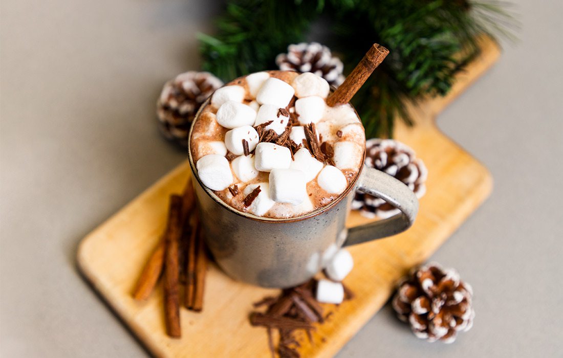 Spiked cocoa served with marshmallows.