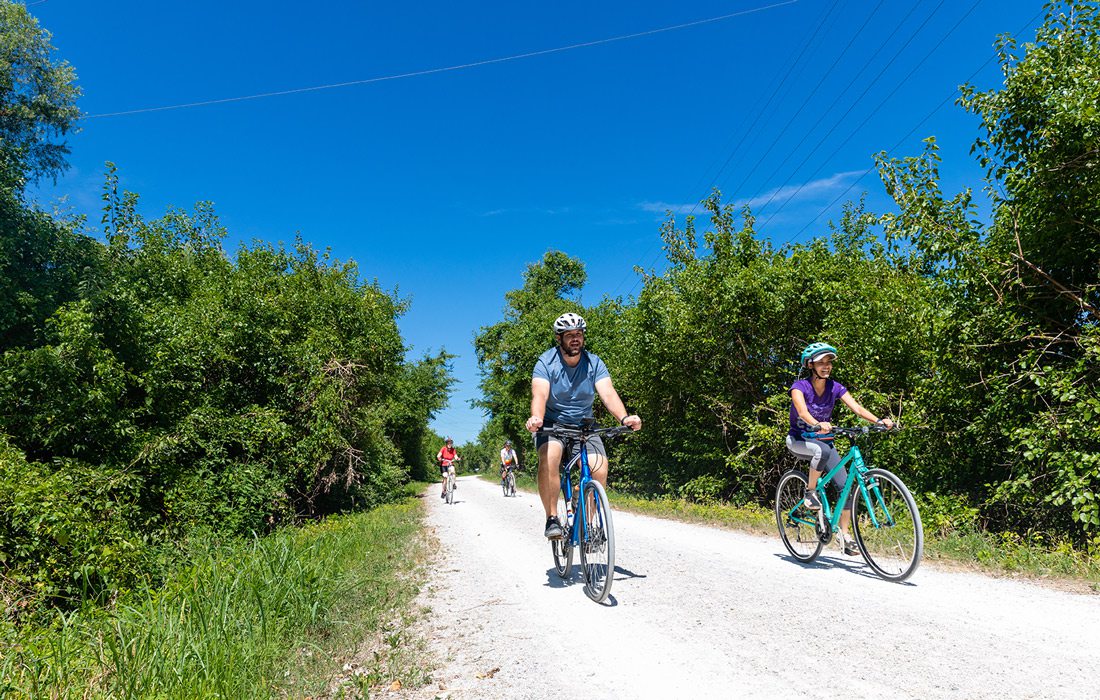 People cycling on a trail in Jefferson City, MO