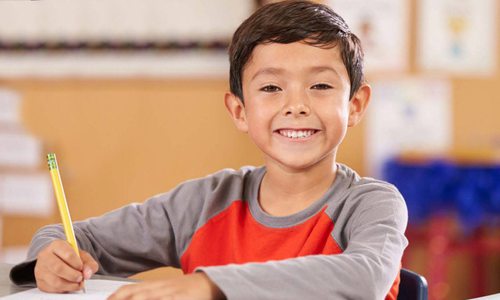 Young boy learning to write at Sylvan Learning Center