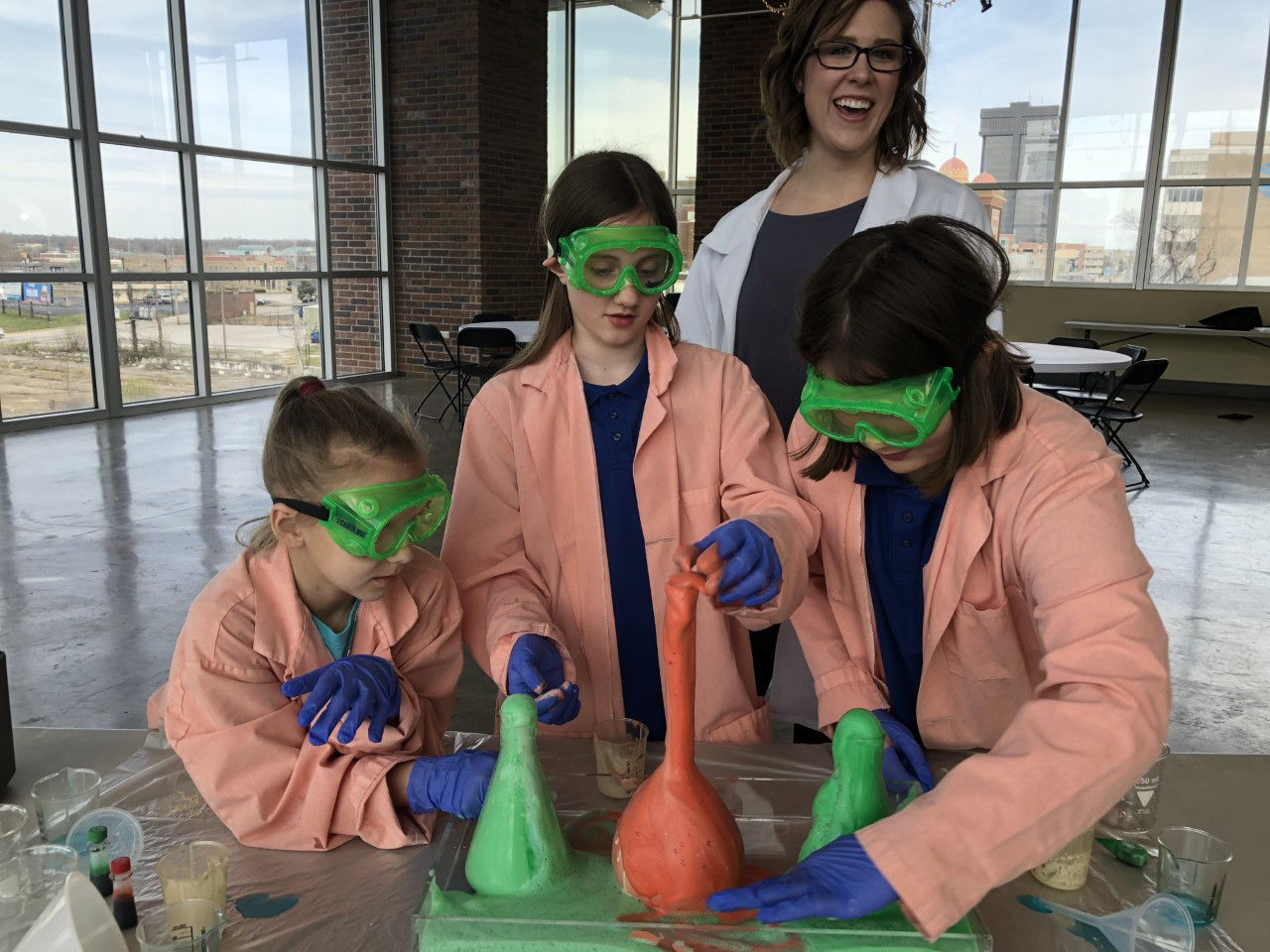 Kids conducting a science experiment at the Discovery Center summer camp in Springfield MO