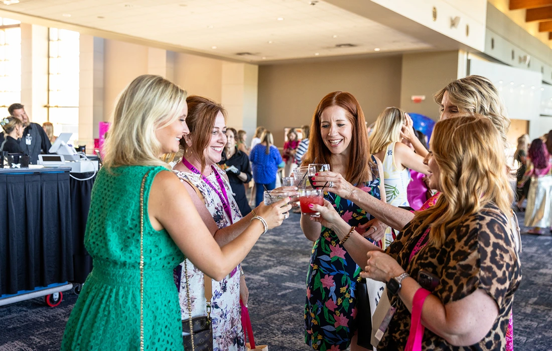 Women toast at Ladies Who Launch in Branson, Missouri.