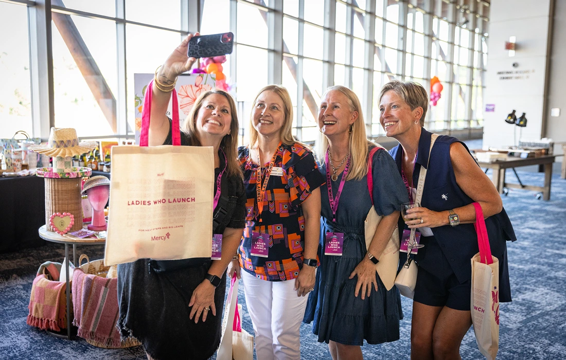 Women taking a photo at Ladies Who Launch in Branson, MO
