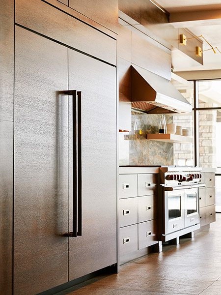 Walnut-stained cabinets in home at Table Rock Lake