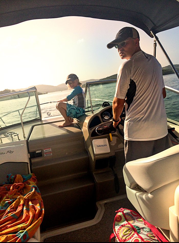Feldman family cruising Table Rock Lake in their cabin cruiser boat