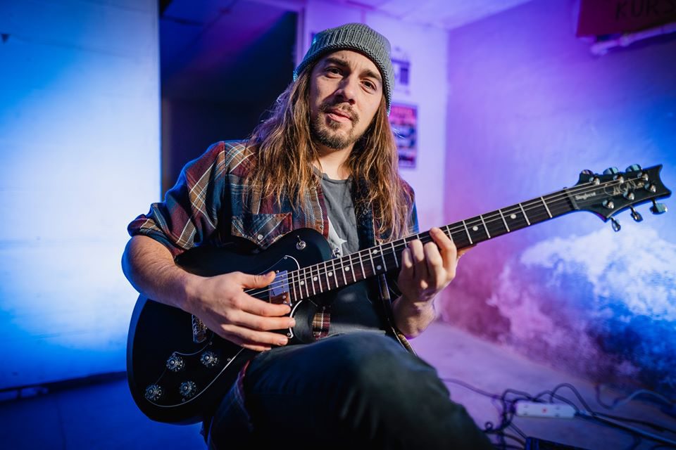 Justin Larkin photo with guitar