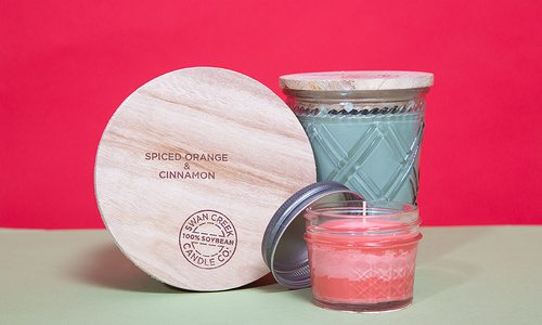 Swan Creek Candle Co. products on red background