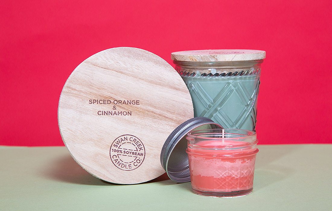Swan Creek Candle Co. products on red background