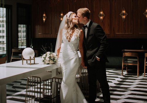 Merry Tucker and her husband on their wedding day at Vantage Rooftop Lounge in Springfield, MO