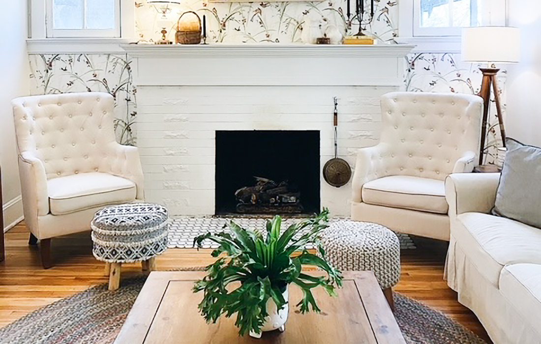 White home with light colored wood floors and plants