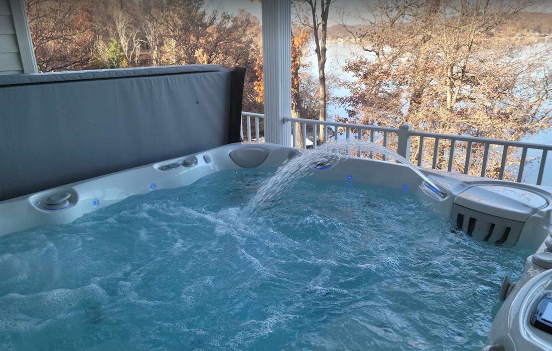 Hot tub on a patio on the lake.