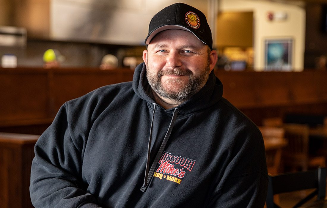 Man in black sweatshirt and hat