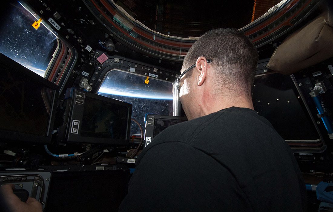 Astronaut Mike Hopkins in The Cupola control tower for the International Space Station