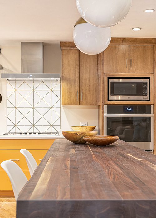 Statement orange cabinets in kitchen design