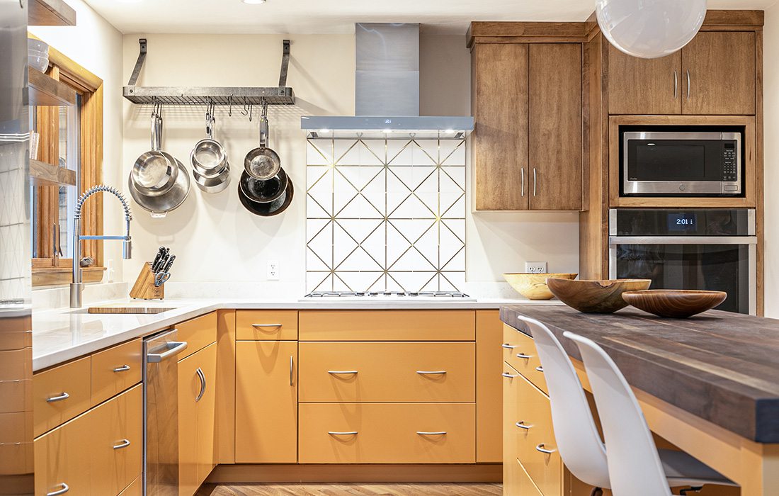 Statement orange cabinets in kitchen design