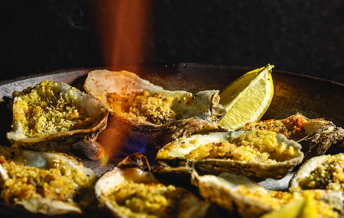 A plate of flaming oysters.