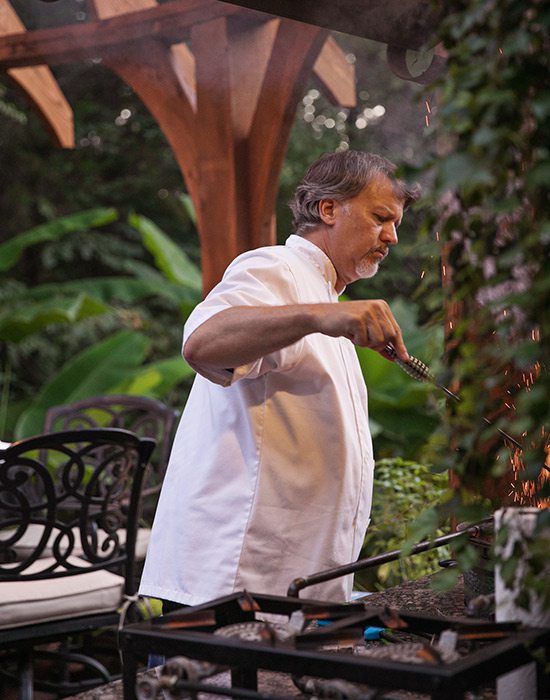 Ron Hill cooking over a Big Green Egg | Hill Home Springfield MO