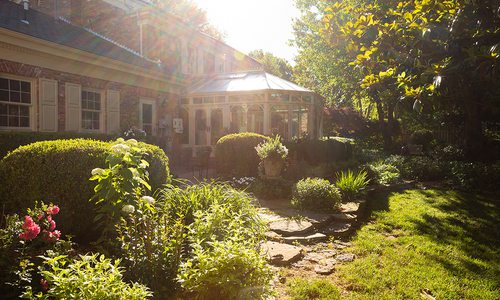 Robert and Peg Carolla’s backyard conservatory and garden