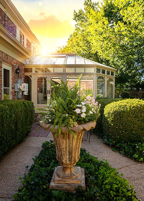 Robert and Peg Carolla’s backyard conservatory and garden