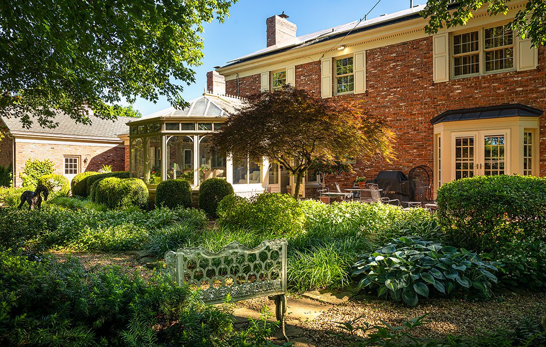 Robert and Peg Carolla’s backyard conservatory and garden