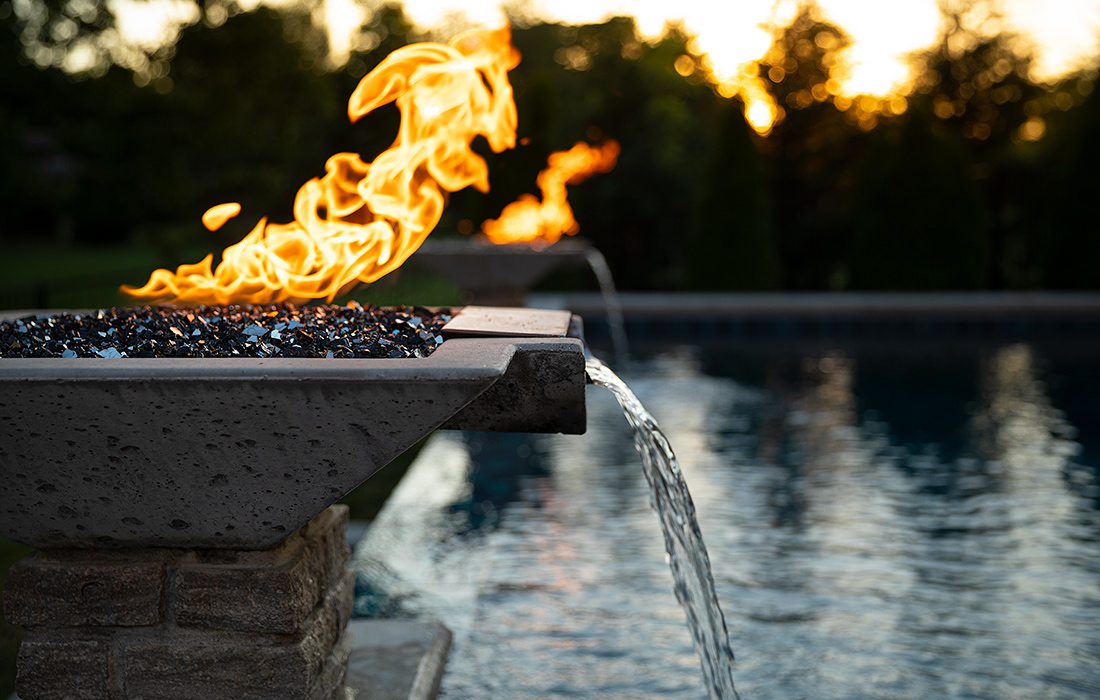 Backyard pool with vanishing waterfall and fire bowls Springfield MO