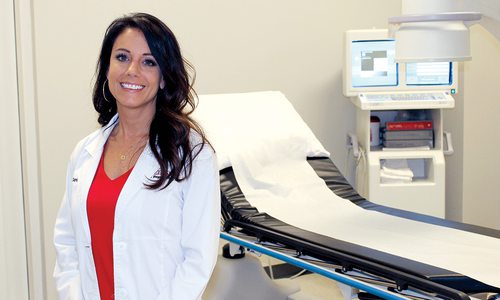 Laura Clark, FNP-C with Ozzie Smith IMAC Regeneration Center