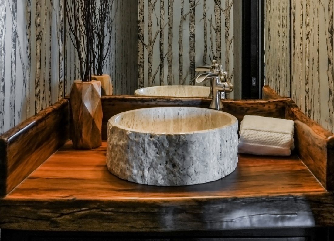 Wood sink and countertop in bathroom designed by Cindy Love Interiors