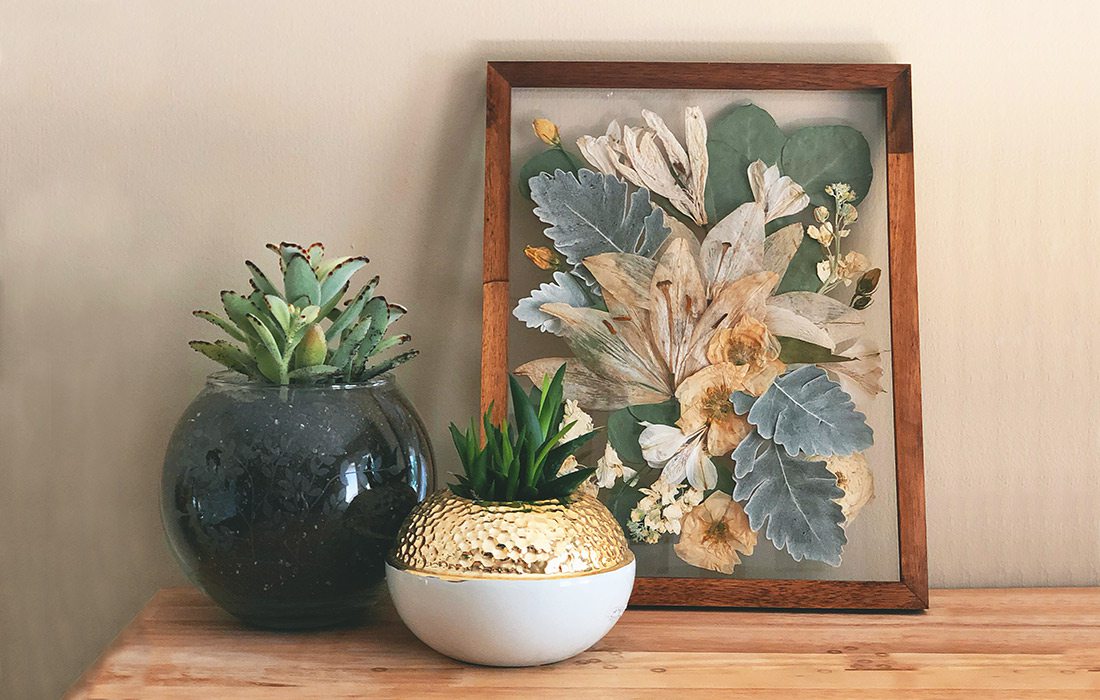 Pressed wedding bouquet in a wooden photo frame