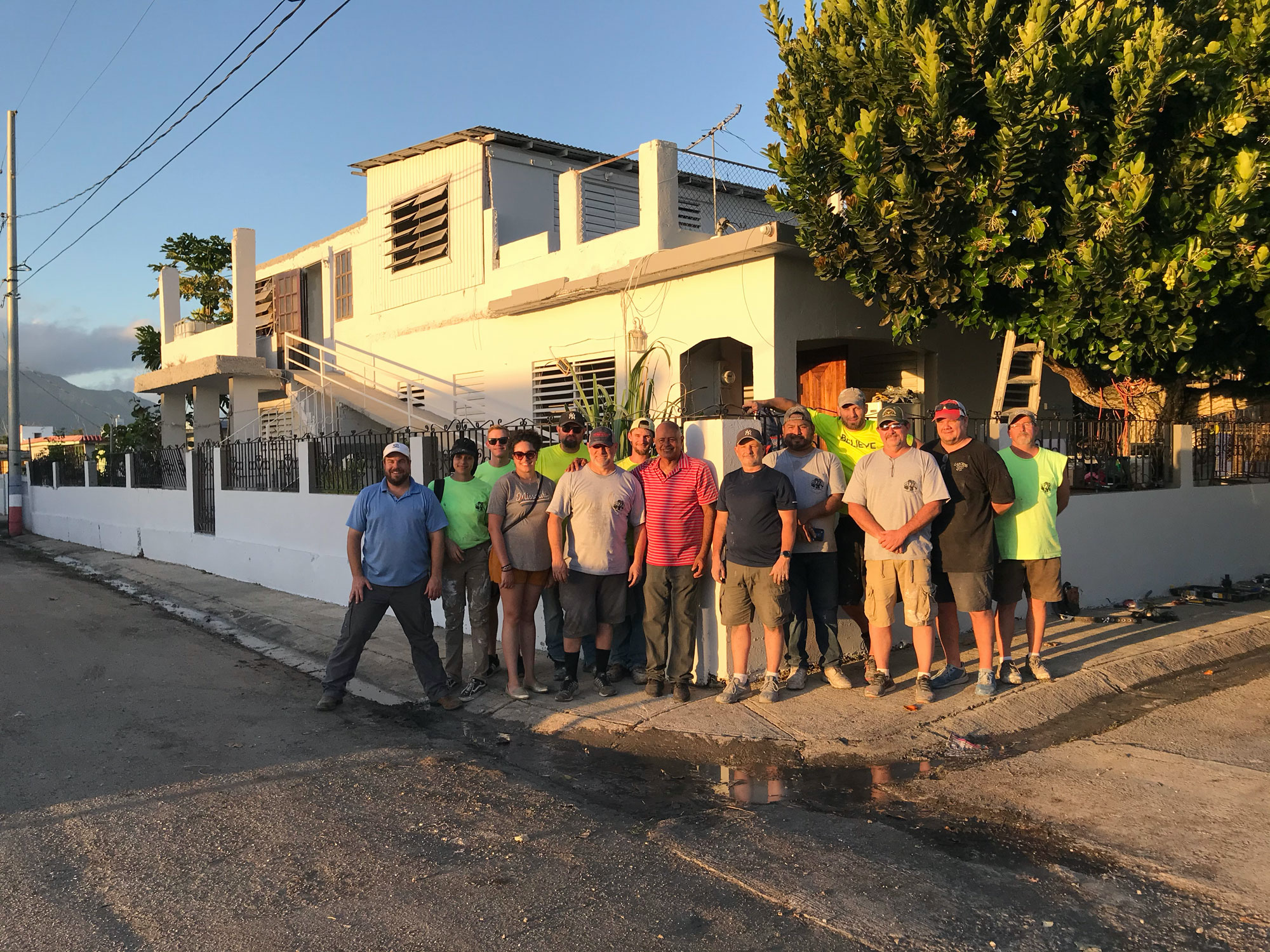 Juanito Borques with the group that renovated his home