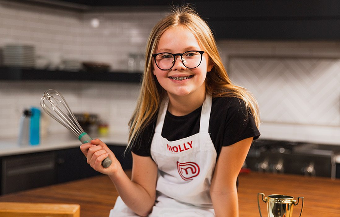 Girl holding whisk