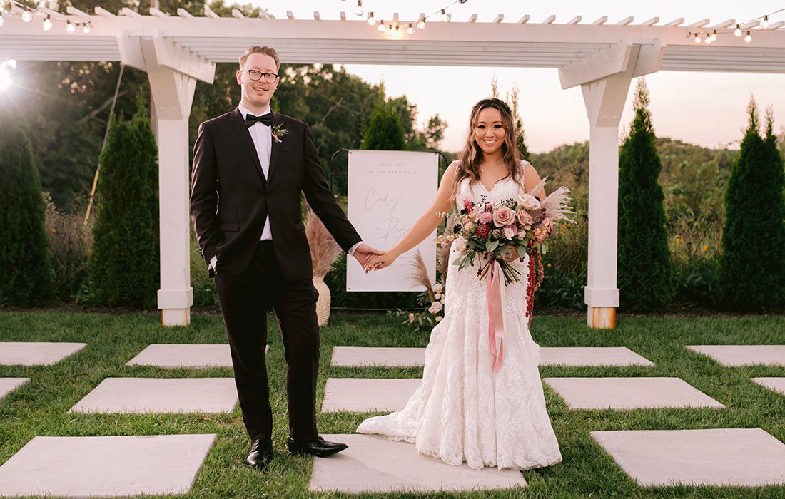 Regan King & Cindy Chao on their wedding day at Greenhouse Two Rivers in Highlandville MO