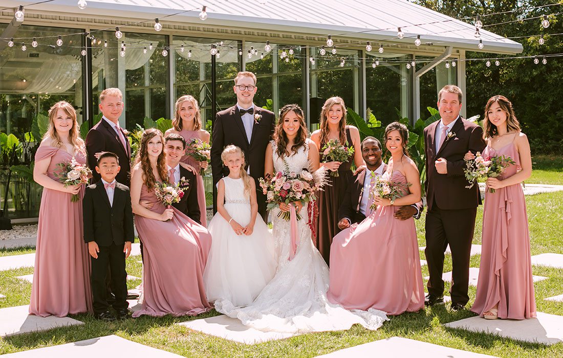 Regan King & Cindy Chao with their wedding party at Greenhouse Two Rivers