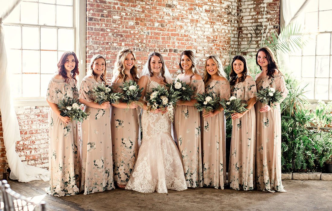 Bride Ali Suman and her wedding party on her wedding day at Venue on Brick in Ozark MO