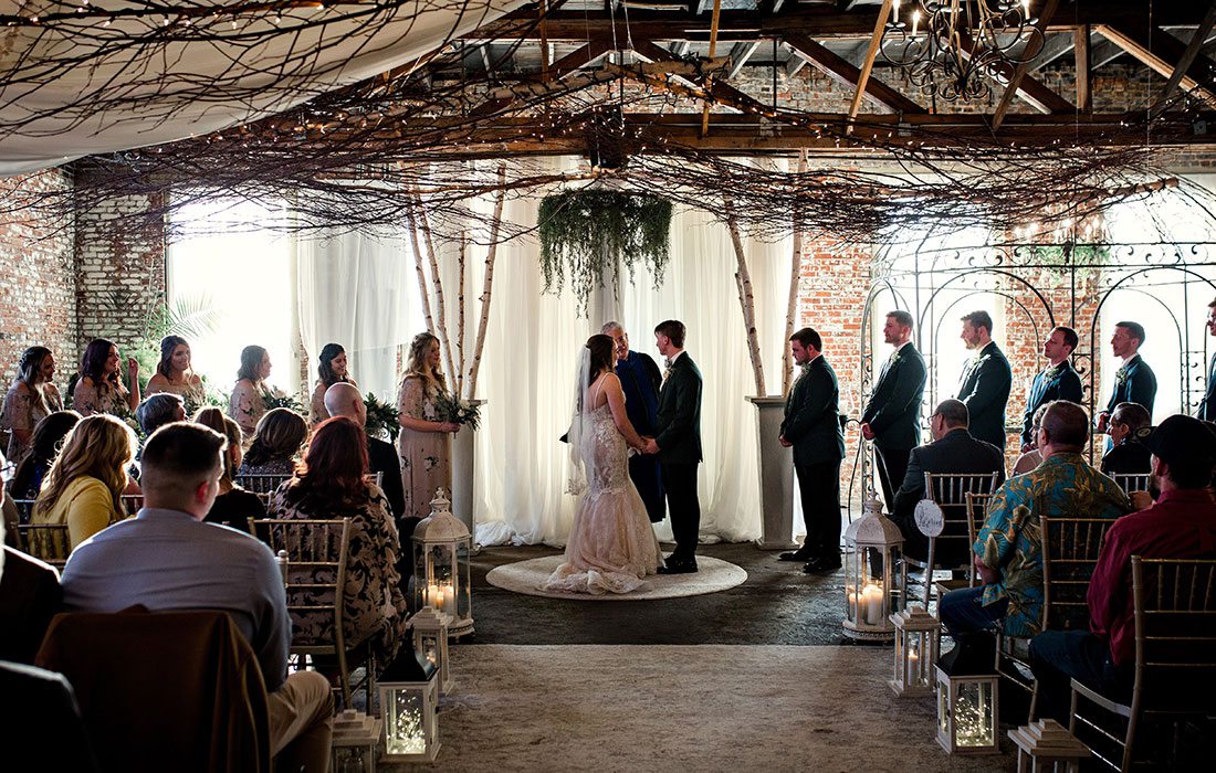 Ali Suman & Rick Peery saying their vows on their wedding day at Venue on Brick in Ozark MO