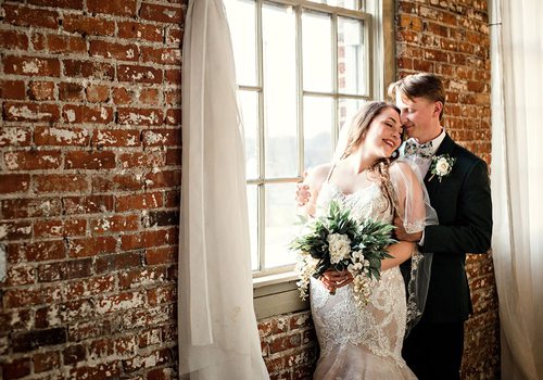 Ali Suman & Rick Peery on their wedding day at Venue on Brick in Ozark MO