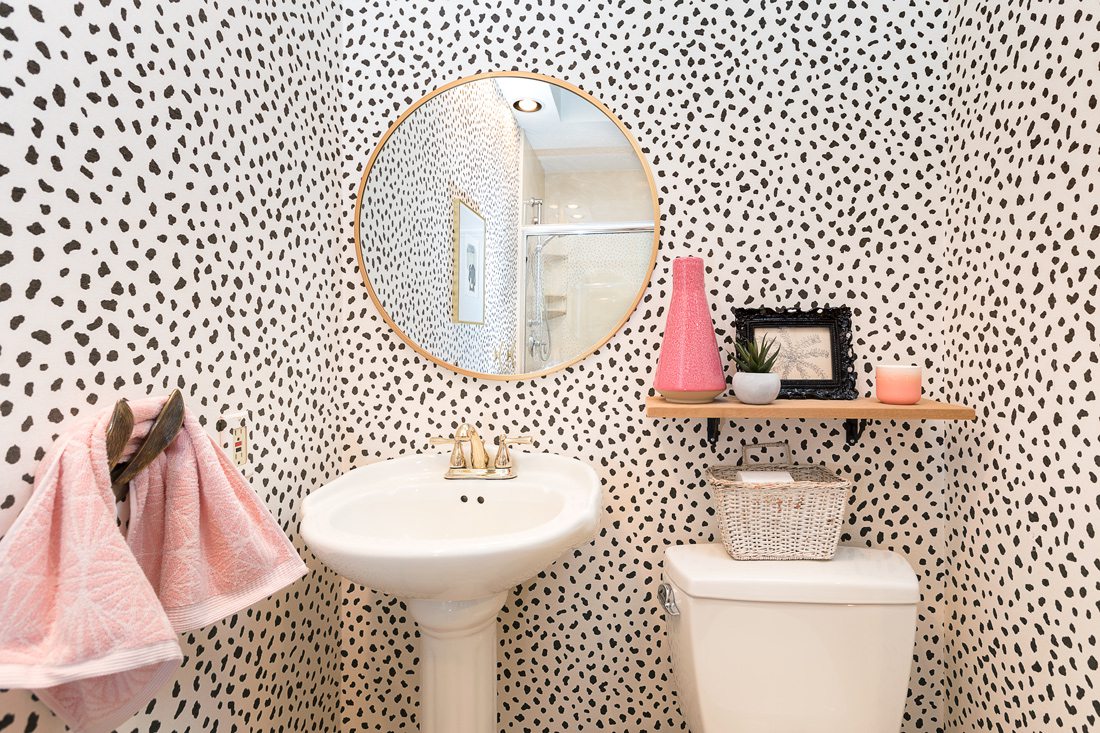 Polka dot wallpaper in funky powder bath.