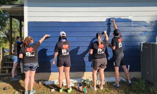 Russell Cellular team painting outdoors