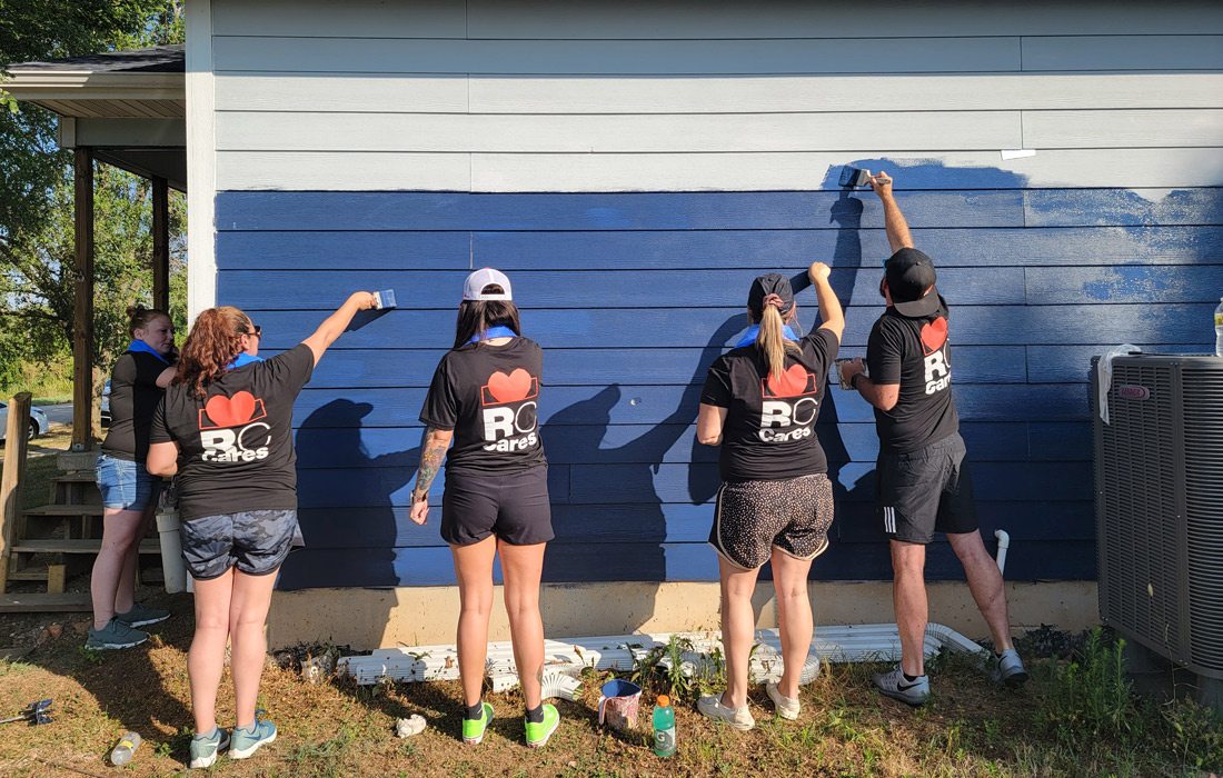 Russell Cellular team painting outdoors