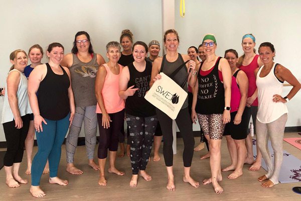 S.W.E.T. Hot Yoga team in the studio.
