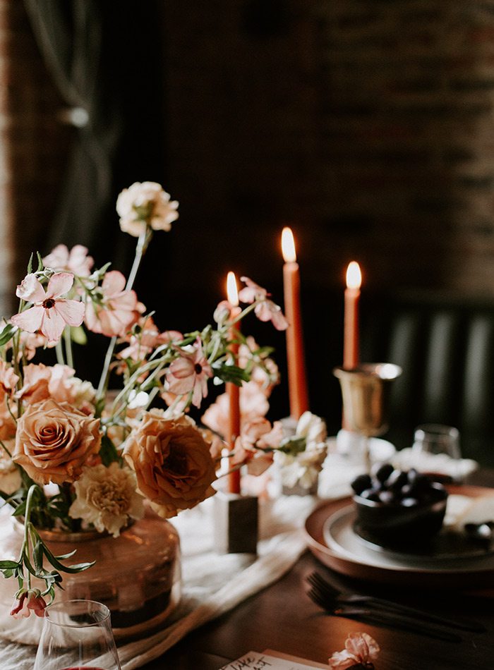 Candles and table decoration in a Wildly Collective wedding design.