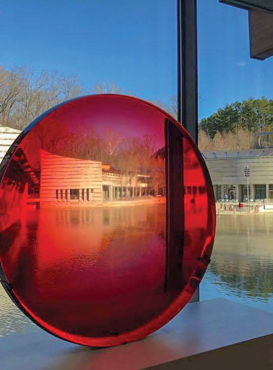 While you’re at Crystal Bridges Museum of American Art, spot pieces like Big Red Lens.