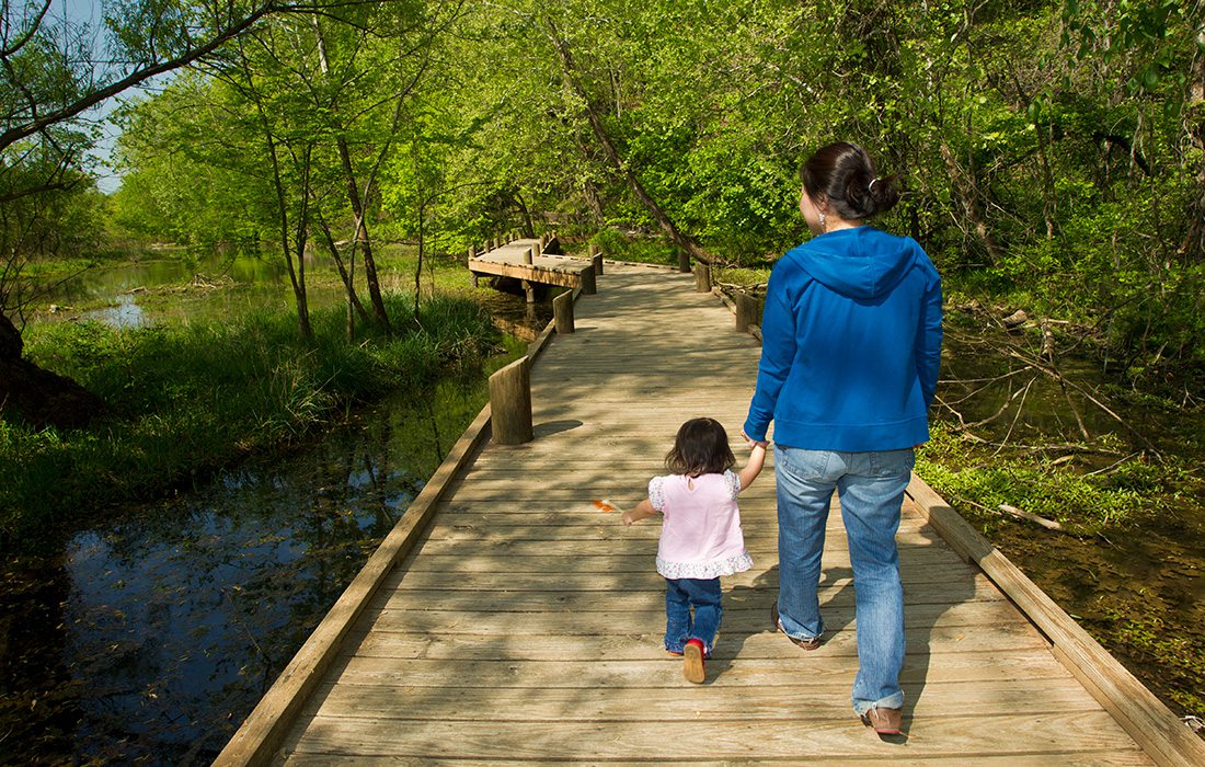 Mother and child on a trail at the Springfield Conservation Nature Center