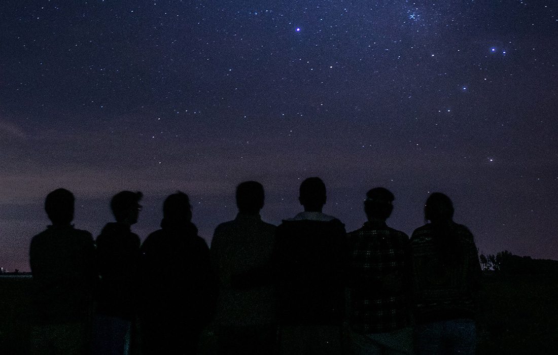 Group of people stargazing