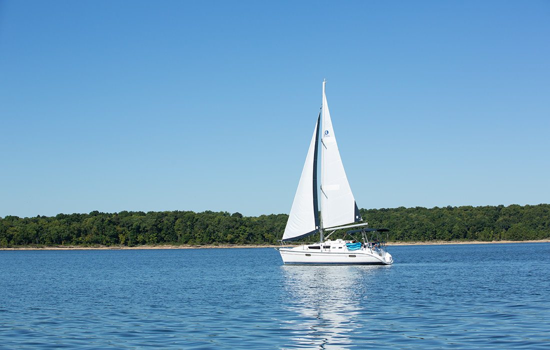 Boat sailing on lake at Stockton State Park, Missouri