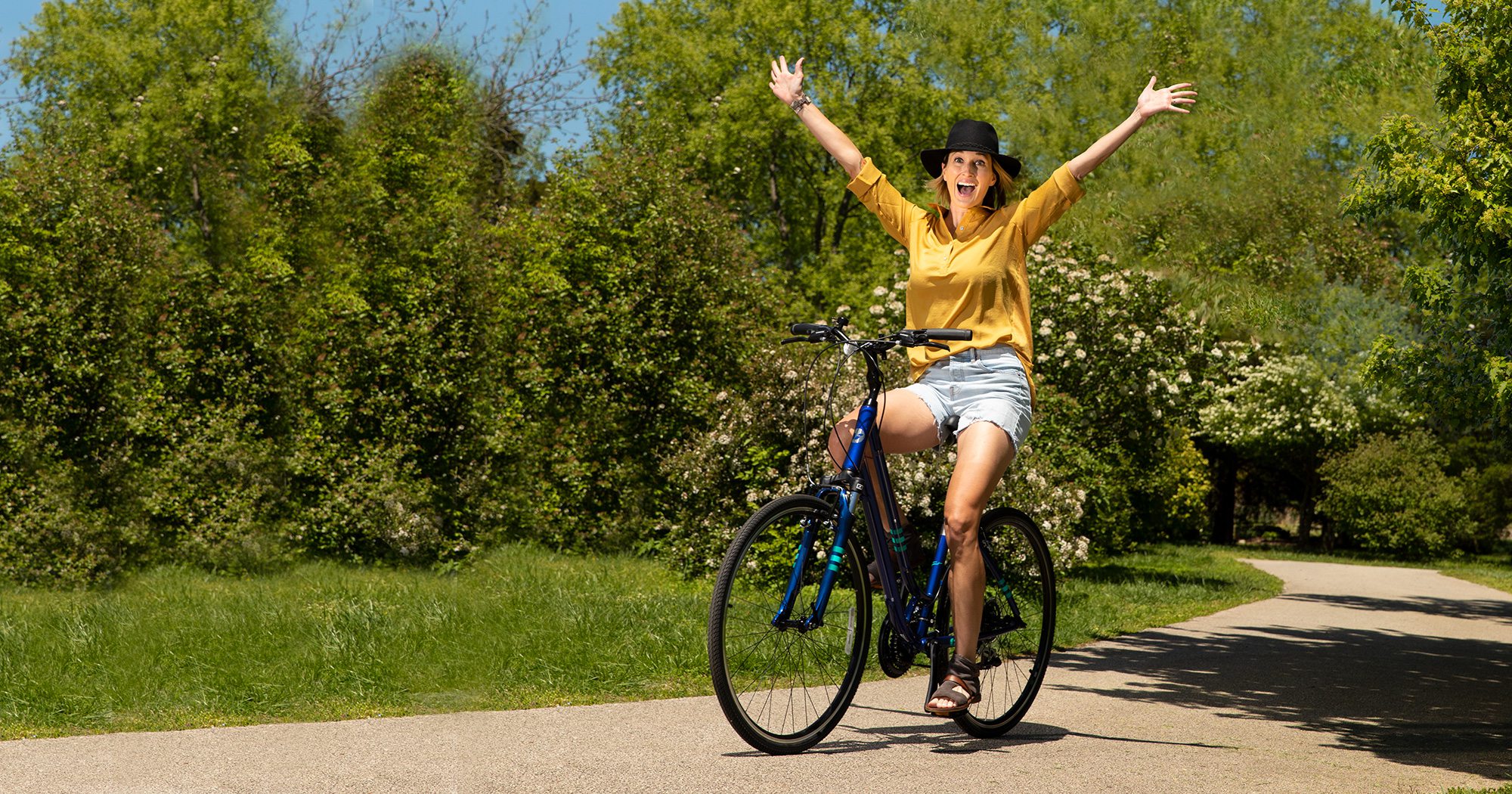 Jessica Pearson riding a bike through Nathanael Greene/Close Memorial Park in Springfield MO