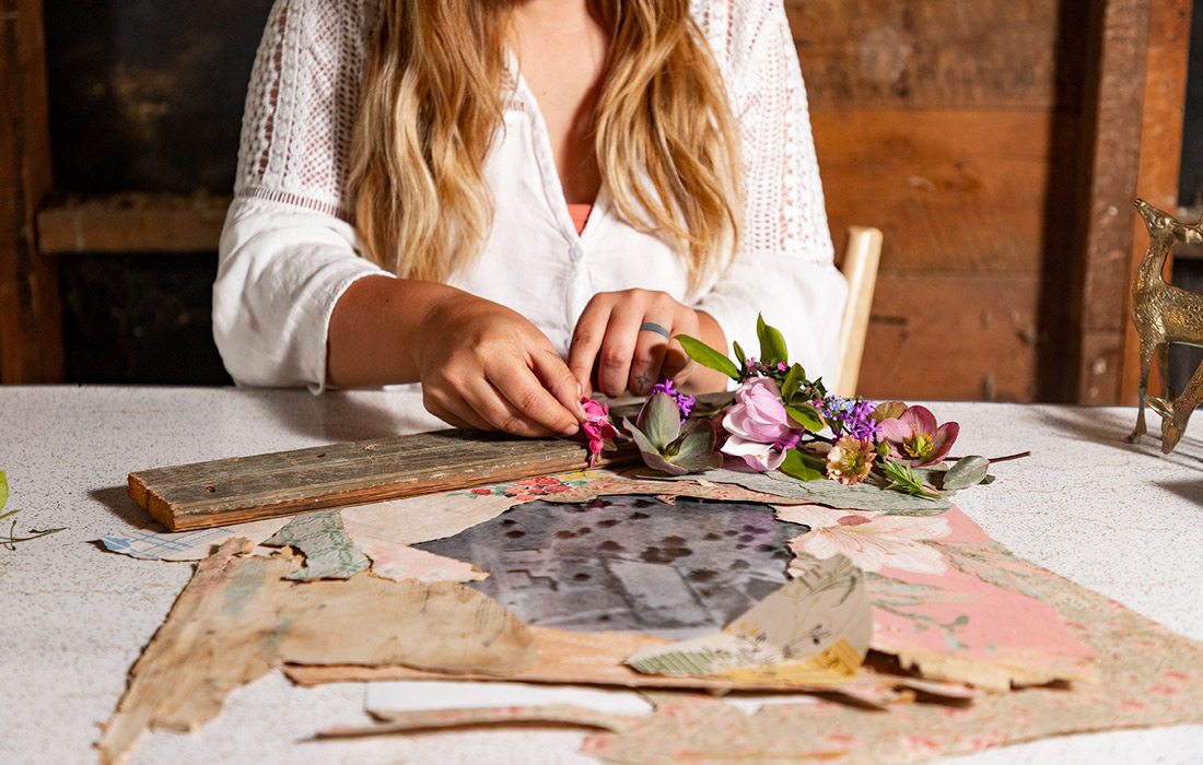 woman with wallpaper scraps